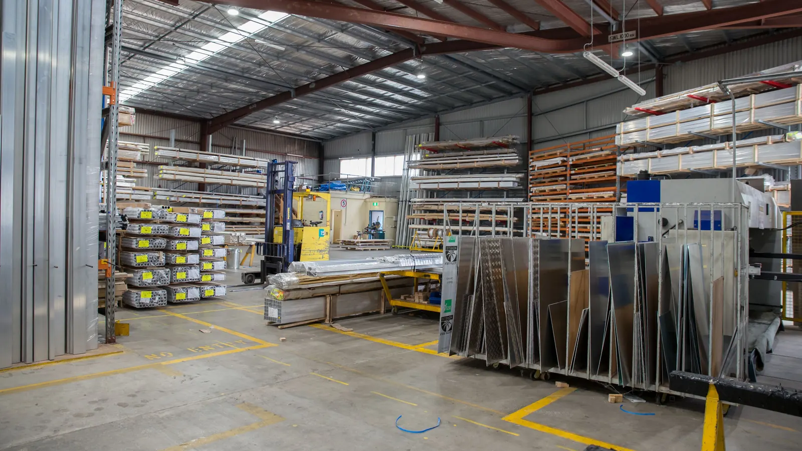 Racking inside a trade supply warehouse stacked with packaged stock